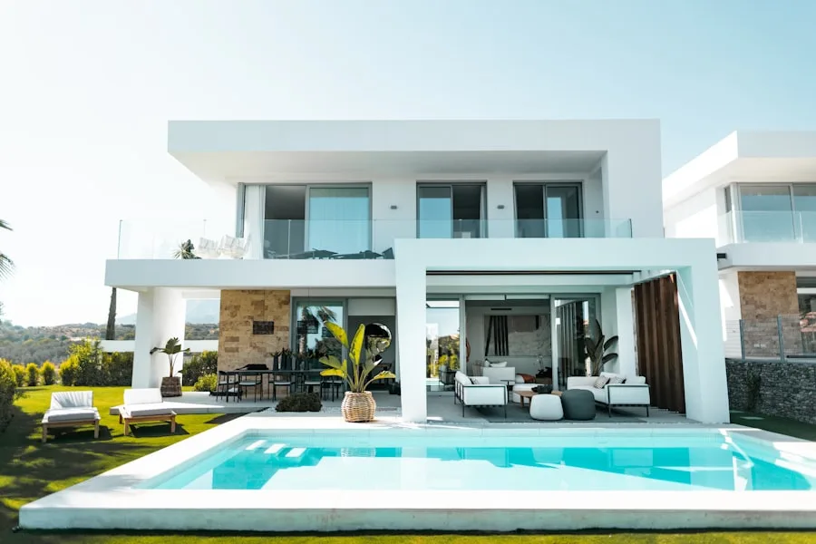 Clean-lined white modern home with covered patio